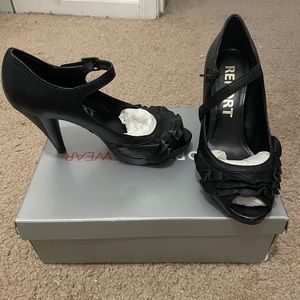 Black heels with ruffle details on open toe